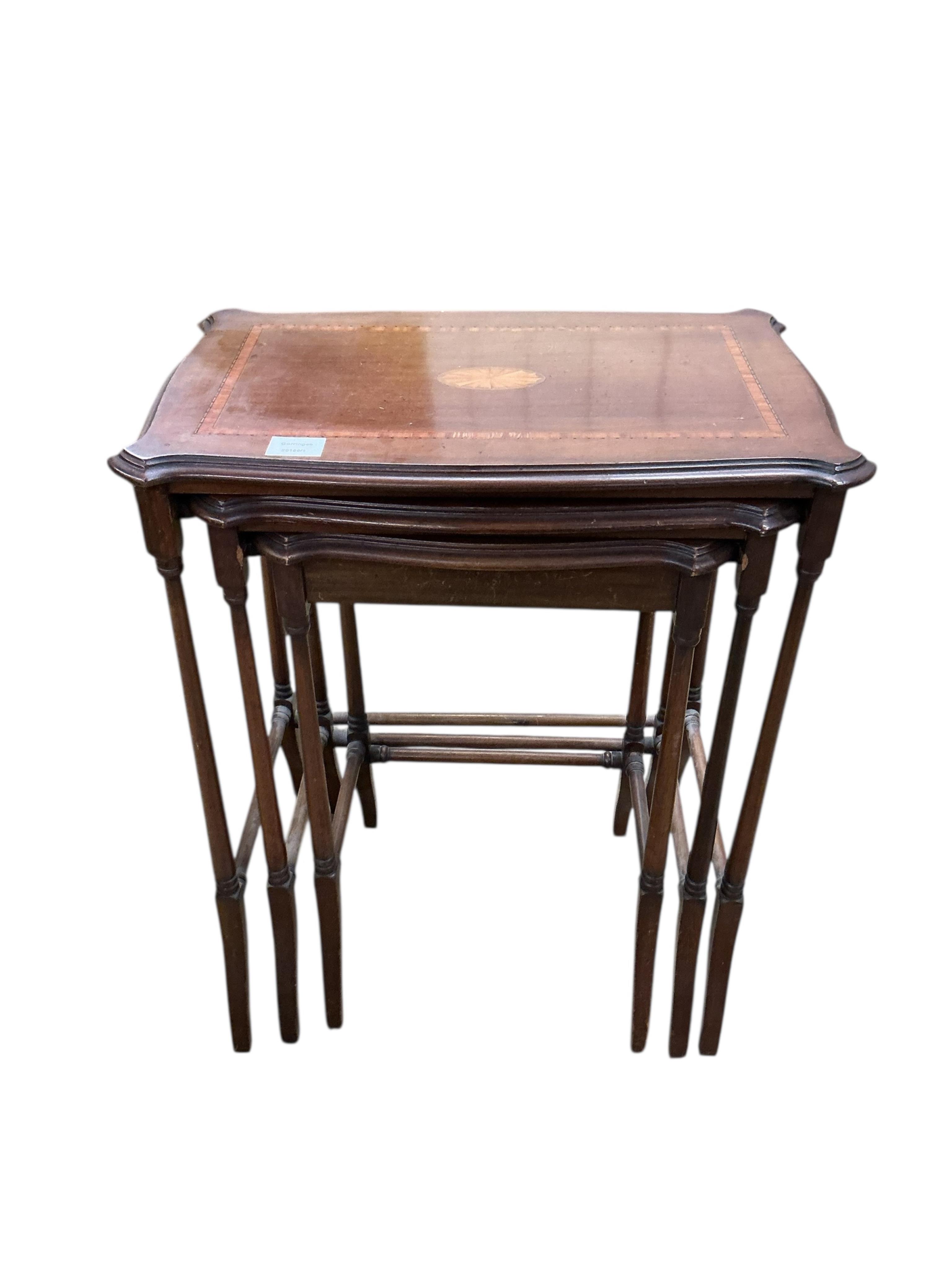 A nest of three Edwardian satinwood banded and inlaid rectangular serpentine tables, width 56cm, depth 36cm, height 66cm